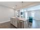 Modern kitchen with granite countertops, stainless steel appliances, and an open view of the living room at 1703 Prospect Way, Conyers, GA 30094
