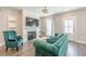 Cozy living room with a fireplace, built-in shelving, hardwood floors, and modern decor at 1703 Prospect Way, Conyers, GA 30094