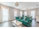 Bright living room with hardwood floors, large windows, and an open floor plan, great for entertaining at 1703 Prospect Way, Conyers, GA 30094