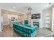 Open-concept living room with hardwood floors, fireplace, and modern decor, connected to kitchen at 1703 Prospect Way, Conyers, GA 30094