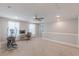 Spacious loft area with carpet, ceiling fan, natural light, and a dedicated space for a home office at 1703 Prospect Way, Conyers, GA 30094
