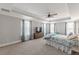 Bright and airy main bedroom with large windows, coffered ceiling, and a sitting area for relaxation at 1703 Prospect Way, Conyers, GA 30094