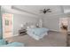 Relaxing main bedroom features a ceiling fan, en suite bathroom, and sitting area at 1703 Prospect Way, Conyers, GA 30094