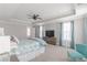 Spacious main bedroom with gray walls, ceiling fan and natural light at 1703 Prospect Way, Conyers, GA 30094