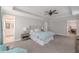 Spacious main bedroom featuring a ceiling fan, ensuite bathroom and exercise room at 1703 Prospect Way, Conyers, GA 30094