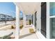 Front porch view with white pillars and a view of the street at 1703 Prospect Way, Conyers, GA 30094