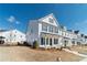 A view of the street shows well-designed homes in a desirable community at 1703 Prospect Way, Conyers, GA 30094
