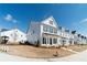 Street view of a row of charming two-story homes with black shutters and white siding at 1703 Prospect Way, Conyers, GA 30094