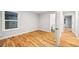 Bright bedroom with hardwood floors, a window, and an ensuite bathroom at 3195 Tackett Rd, Douglasville, GA 30135