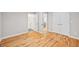 Bedroom featuring hardwood floors, closet, and an ensuite bathroom at 3195 Tackett Rd, Douglasville, GA 30135