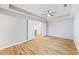 Spacious bedroom with hardwood floors, a tray ceiling, and neutral paint at 3195 Tackett Rd, Douglasville, GA 30135