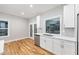 Well-lit kitchen boasts white cabinets, stainless steel appliances, and a view to the outside through a bright window at 3195 Tackett Rd, Douglasville, GA 30135