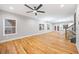 Spacious living room featuring hardwood floors, modern lighting, and lots of natural light at 3195 Tackett Rd, Douglasville, GA 30135