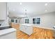 Wide-open living room featuring hardwood floors, recessed lighting, a ceiling fan and an adjoining kitchen at 3195 Tackett Rd, Douglasville, GA 30135