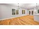 Open living area featuring hardwood floors, modern lighting, and ample natural light at 3195 Tackett Rd, Douglasville, GA 30135