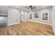 Living room with beautiful hardwood floors, neutral walls, ceiling fan and large windows at 3195 Tackett Rd, Douglasville, GA 30135
