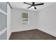 Comfortable bedroom featuring hardwood floors, white walls and a sliding door with glass panels at 3850 Crosby Nw Dr, Atlanta, GA 30331