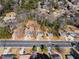 Wide aerial shot of the property highlighting the neighborhood layout and nearby road at 147 Windy Hill Sw Rd, Marietta, GA 30060