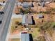 An aerial view of a home with a large yard and mature trees, along a road at 147 Windy Hill Sw Rd, Marietta, GA 30060