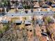 Aerial view of the homes along a road, featuring well-maintained lawns at 147 Windy Hill Sw Rd, Marietta, GA 30060
