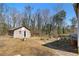 Backyard featuring shed with path and tools, perfect for outdoor activities and relaxation at 147 Windy Hill Sw Rd, Marietta, GA 30060