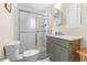 Bathroom features a tiled shower with sliding doors, a vanity with sink, and a toilet at 147 Windy Hill Sw Rd, Marietta, GA 30060