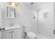 Bathroom features a tiled shower with built-in niche, a toilet, and a vanity with sink at 147 Windy Hill Sw Rd, Marietta, GA 30060