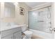 Bathroom featuring a shower with glass sliding doors, white toilet, and grey vanity at 147 Windy Hill Sw Rd, Marietta, GA 30060