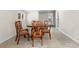 Dining room with round table, four chairs, tile floor, and glass doors at 147 Windy Hill Sw Rd, Marietta, GA 30060