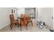 Dining room with round table, four chairs, tile floor, and glass doors. Needs TLC at 147 Windy Hill Sw Rd, Marietta, GA 30060