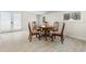 Dining room with round table, four chairs, tile floor, and glass doors at 147 Windy Hill Sw Rd, Marietta, GA 30060