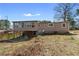 View of the back of the house showing the outdoor back porch with a fenced in backyard at 147 Windy Hill Sw Rd, Marietta, GA 30060