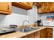 Kitchen sink with stainless steel dual basin, faucet, laminate countertop, and appliances at 147 Windy Hill Sw Rd, Marietta, GA 30060