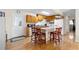 Spacious kitchen featuring an island with seating, ample cabinet space, and a convenient side door access at 147 Windy Hill Sw Rd, Marietta, GA 30060