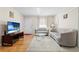 Comfortable living room with a large television, plush seating, and bright lighting for a relaxing atmosphere at 147 Windy Hill Sw Rd, Marietta, GA 30060