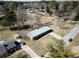 Aerial view of neighborhood including home with long footprint and metal roof at 3894 Summit Dr, Douglasville, GA 30135