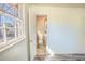 View from bedroom of adjacent bathroom including toilet and sink at 3894 Summit Dr, Douglasville, GA 30135