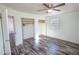 Bedroom with hardwood floors, a ceiling fan, and large closets, providing ample storage space at 3894 Summit Dr, Douglasville, GA 30135