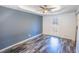 Bedroom with gray walls, hardwood floors, and a ceiling fan at 3894 Summit Dr, Douglasville, GA 30135