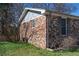 Brick exterior corner showing window and side view of the house in natural lighting at 3894 Summit Dr, Douglasville, GA 30135
