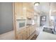 A kitchen with white countertops and appliances including a double sink at 3894 Summit Dr, Douglasville, GA 30135