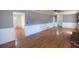 Open-concept living room featuring hardwood floors, neutral walls, and ample natural light at 3894 Summit Dr, Douglasville, GA 30135