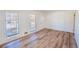 Bright living room featuring beautiful laminate flooring and ample natural light at 3894 Summit Dr, Douglasville, GA 30135