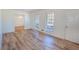 Bright living room featuring beautiful laminate flooring, lots of natural light, and an open floor plan at 3894 Summit Dr, Douglasville, GA 30135