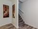 Carpeted staircase with white railing and neutral walls at 3970 Church View Ln, Suwanee, GA 30024