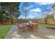Outdoor patio with table and seating, perfect for enjoying backyard views and outdoor dining with green grass at 4198 Haynes Mill Nw Ct, Kennesaw, GA 30144