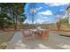 Outdoor patio with table and seating, perfect for enjoying backyard views and outdoor dining at 4198 Haynes Mill Nw Ct, Kennesaw, GA 30144