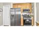 Modern kitchen with stainless steel appliances and wooden cabinets at 4198 Haynes Mill Nw Ct, Kennesaw, GA 30144