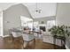 Open living room with vaulted ceilings, fireplace, and wood floors throughout at 4198 Haynes Mill Nw Ct, Kennesaw, GA 30144