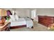 Elegant main bedroom with a large bed, dresser, and plenty of natural light at 4198 Haynes Mill Nw Ct, Kennesaw, GA 30144